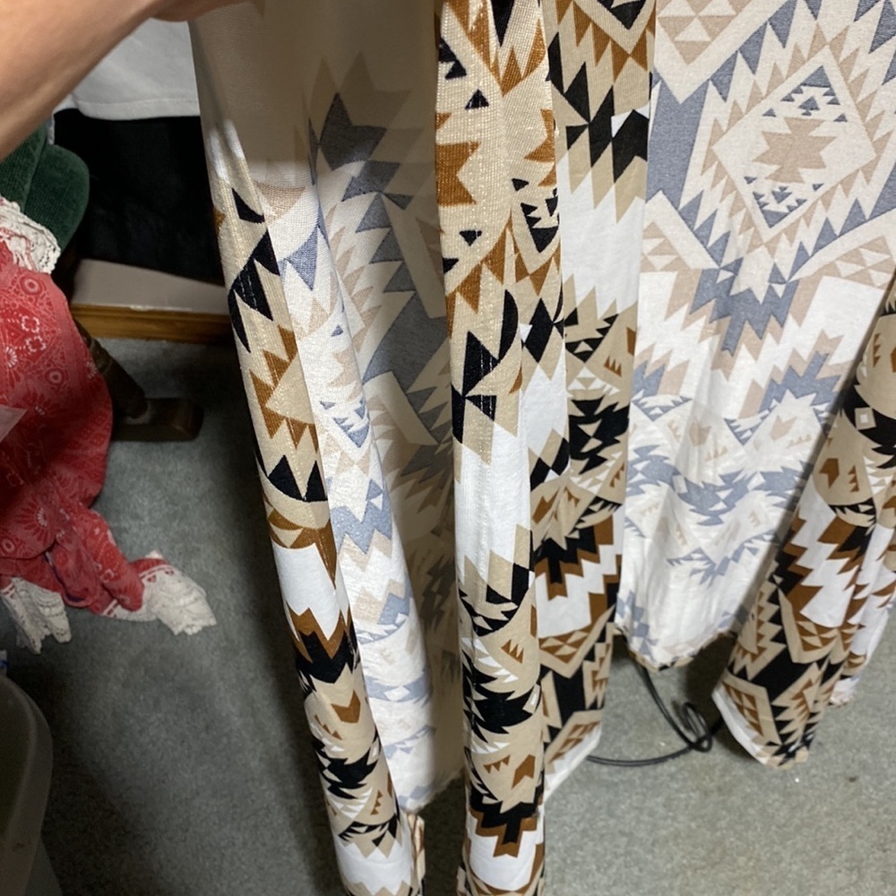 The new Lularoe Savannah is a sleeveless cape​​​​ - Picture 2 of 5